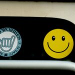 a close up of a traffic light with a smiley face